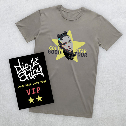 A granite grey t-shirt featuring a graphic of the face of Die Shiny's lead singer inside a yellow star with "GOLD STAR GOOD TOUR" text, shown alongside a black VIP card on a light gray textured background.
