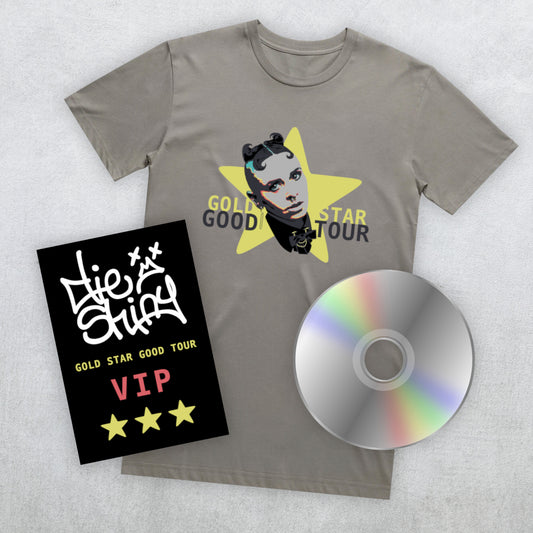 A granite grey t-shirt featuring a graphic of the face of Die Shiny's lead singer inside a yellow star with "GOLD STAR GOOD TOUR" text, shown alongside a black VIP card and a silver CD on a light gray textured background.
